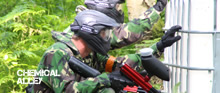 <Small image of paintball players behind a IBC>